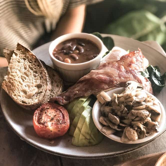 Avocado With Bacon, Mushrooms, And Beans With A Slice Of Sourdough From Betelnut Cafe In Canggu Bali
